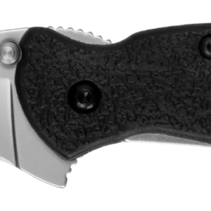 The image depicts a folding knife oriented horizontally. It has a stainless steel blade with a polished finish and a subtle curvature that extends towards the tip. The blade is reflected prominently on the upper side. The handle is made from textured black material, featuring a patterned surface for enhanced grip. Two black screws are visible on the handle, indicating the attachment points, while a small hole for a lanyard is present at the handle's end. The knife is shown against a plain background, enhancing its details.