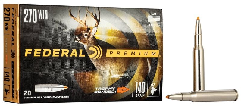 FEDERAL 270 WIN 140GR TROPHY BONDED TIP - A box of Federal Premium 270 Win 140 grain Trophy Bonded Tip rifle ammunition is displayed alongside two individual rounds, against a white background. The box features a black background and a deer graphic. The words "Federal Premium" are prominently displayed in gold lettering. The two rounds have a silver casing and an orange tip.