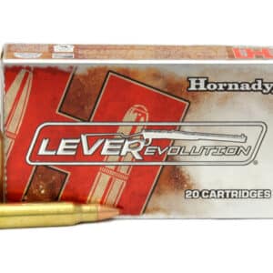 A box of Hornady LEVERevolution ammunition with one cartridge lying in front.