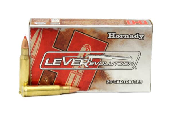 A box of Hornady LEVERevolution ammunition with one cartridge lying in front.