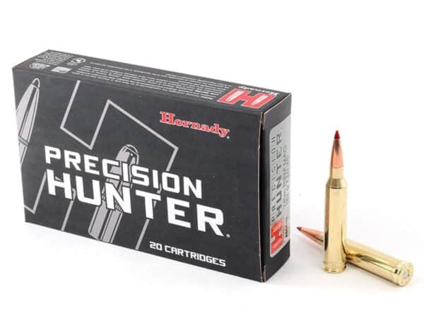 A box of Hornady Precision Hunter cartridges with two rounds beside it.