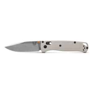BENCHMADE BUGOUT TAN GRIVORY - A Benchmade Bugout folding knife with a tan textured handle and a matte grey blade, open and laid horizontally on a white background. The blade is etched with the Benchmade butterfly logo.