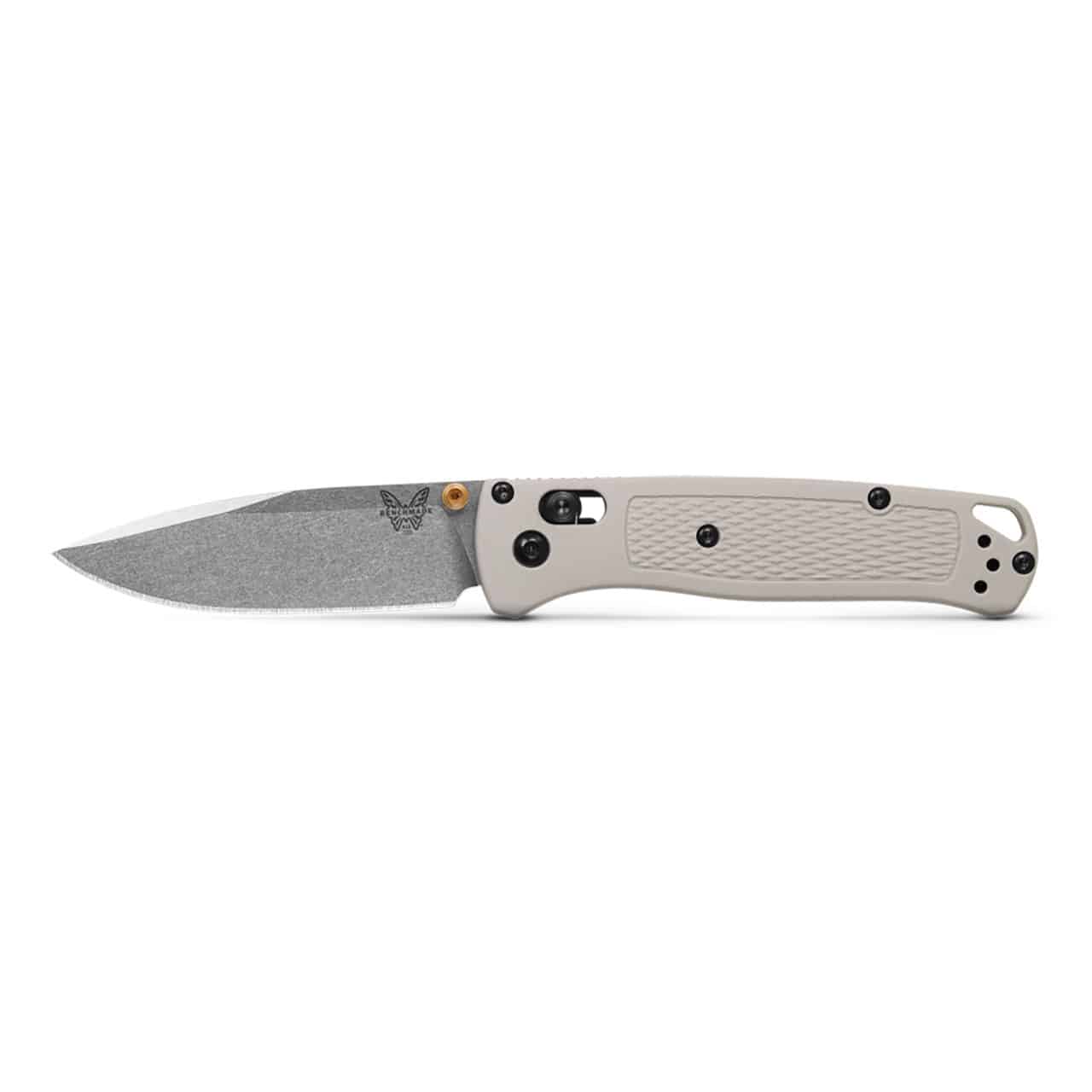 BENCHMADE BUGOUT TAN GRIVORY - A Benchmade Bugout folding knife with a tan textured handle and a matte grey blade, open and laid horizontally on a white background. The blade is etched with the Benchmade butterfly logo.