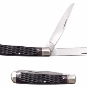 COLD STEEL TRAPPER KNIFE - JIGGED BONE - Two stainless steel pocket knives, one with blades open, one closed, both with dark brown textured handles, and steel bolsters, and rivets, against a white background. The open knife has two blades, with one partially open and toothed along the top edge of the blade.