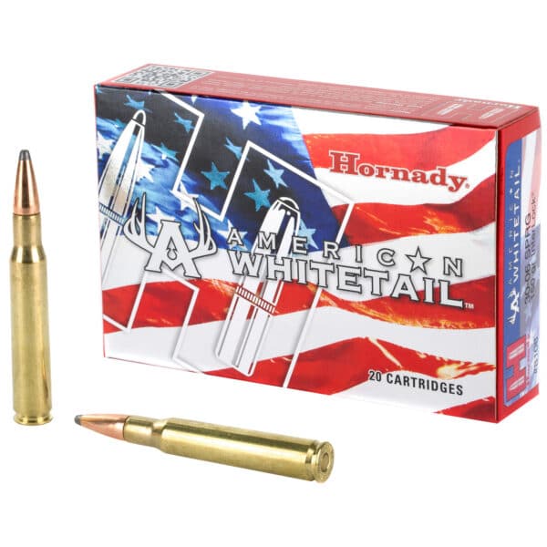 A box of Hornady American Whitetail ammunition with two cartridges beside it, featuring a design with the American flag.