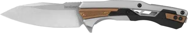 The image displays a folding knife viewed from the side, with a blade angled slightly upward. The blade has a polished silver finish, exhibiting a curved edge and a flat tip. The handle features a combination of metallic silver, textured black rubber, and bronze inlays. Three visible screws and functional cutouts enhance the ergonomic grip. The knife's overall design balances aesthetics with practicality, suited for everyday carry or outdoor use.