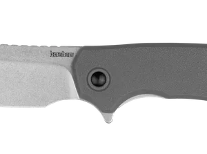 KERSHAW WHARF, A sleek, gray folding knife with a unique blade shape and textured handle, ideal for outdoor or everyday use.