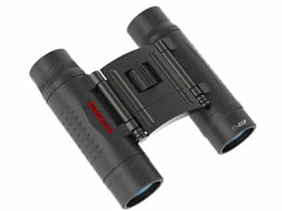 TASCO ESSENTIALS 10X25 COMPACT BINOCULAR - Close-up of compact Tasco binoculars, featuring a black body with red branding, designed for portability and outdoor use.