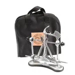 WARTHOG V-SHARP CLASSIC II POUCH - A metal knife sharpener with a base and handle, next to a black carrying case with a logo patch.