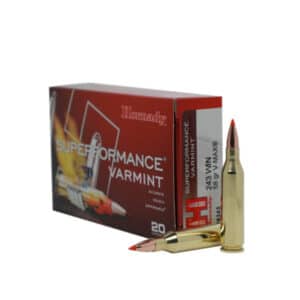 A box of Hornady Superformance Varmint ammunition with two visible .243 WIN cartridges, featuring pointed tips and bright red polymer tips.