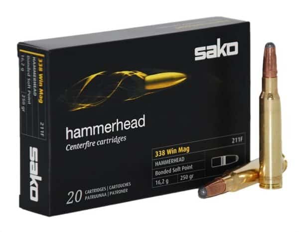 Box of Sako Hammerhead .338 Win Mag centerfire rifle cartridges with one round beside it.