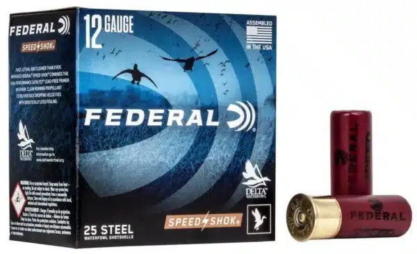 Box of Federal 12 Gauge shotgun shells with one shell standing upright next to the box.