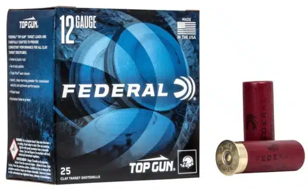 A box of Federal Top Gun 12 gauge clay target shotgun shells next to two loose shells.