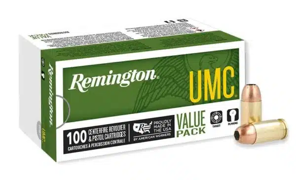 Box of Remington UMC revolver and pistol cartridges with two bullets displayed outside.