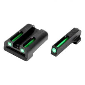 Glowing green fiber-optic gun sights on a white background.