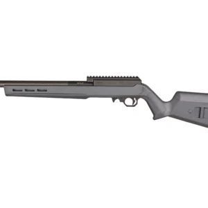 A side profile of a gray rifle displayed against a plain background. The rifle features a long barrel and a textured stock with a prominent butt pad. A rail system is visible on top, indicating the option for mounting accessories.