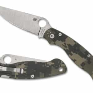 SPYDERCO MILITARY 2 CAMO G-10 PLAINEDGE. A tactical folding knife with a stainless steel blade and a camouflaged handle, partially open and resting beside its closed form.