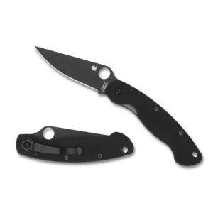 SPYDERCO MILITARY MODEL BLACK G-10 BLACK BLADE PLAINEDGE. A black folding knife with a sleek blade, partially opened, showcasing textured grip and pocket clip on a white background.