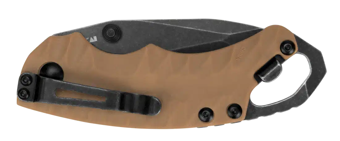 A compact folding knife with a tan handle and a black blade, featuring a pocket clip and a carabiner attachment.