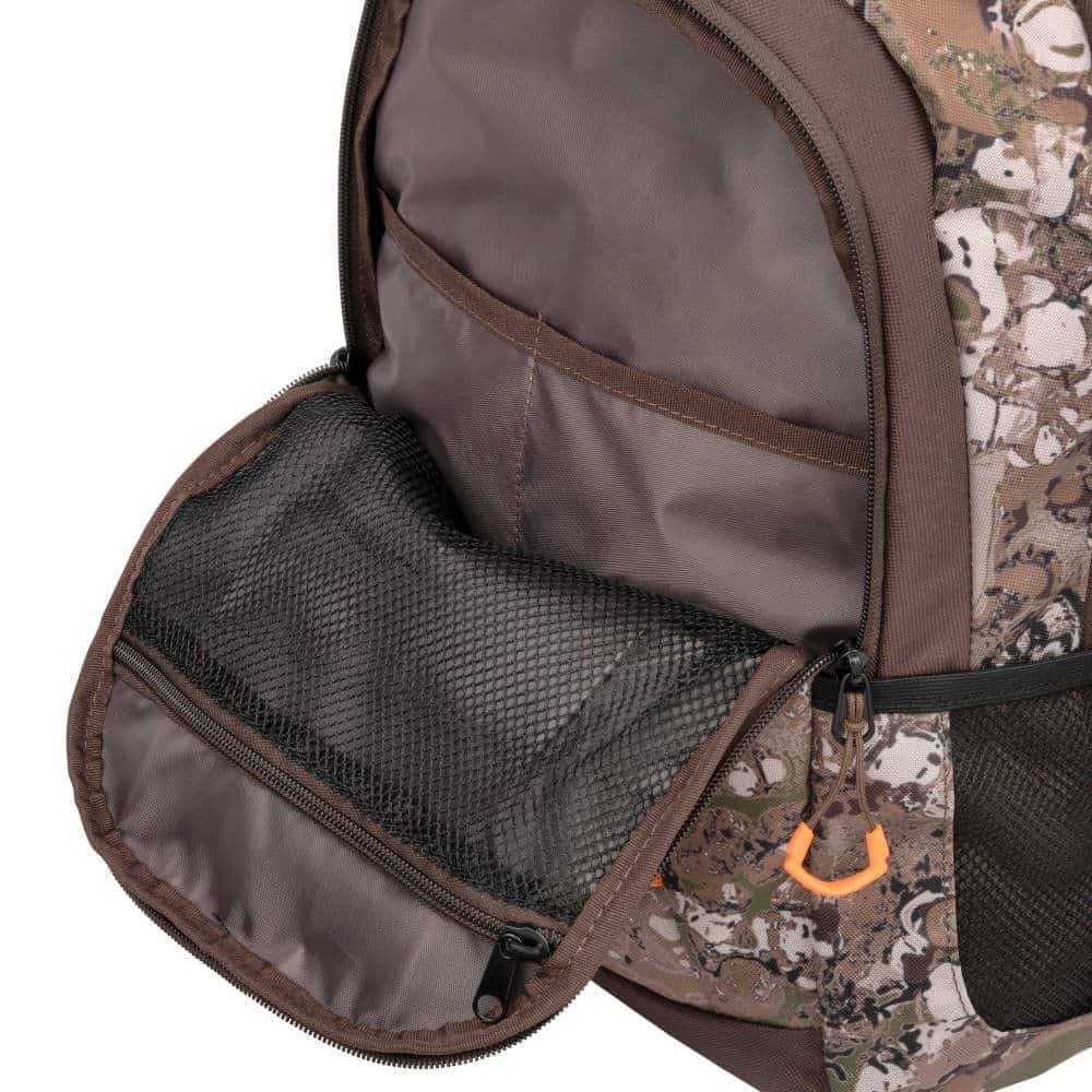 Close-up of a patterned backpack pocket featuring a mesh zipper compartment for convenient organization and storage.