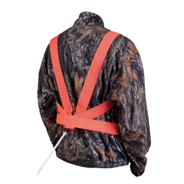 A person wearing a camo jacket with bright orange deer drag harness straps, designed for visibility during outdoor activities.