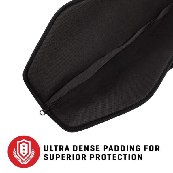 A close-up view of a black padded bag interior, highlighting ultra-dense padding for superior protection. Red shield logo and text below.