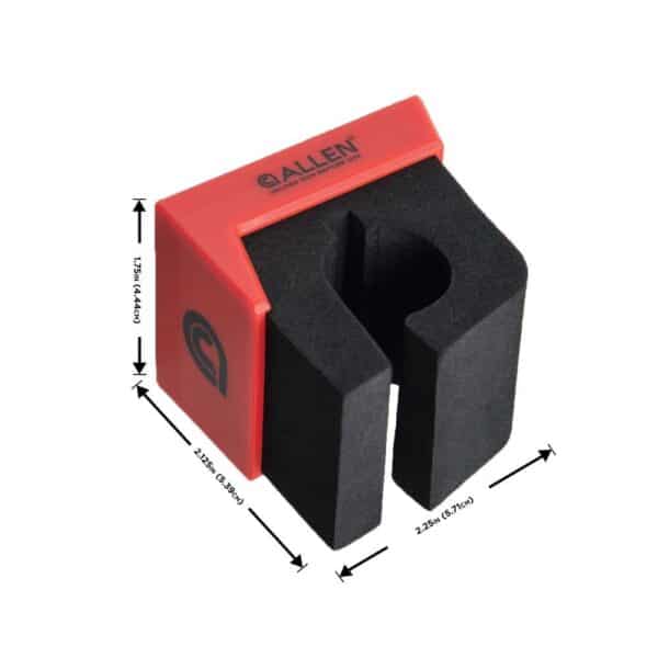 A red and black gun rest with dimensions labeled, designed for stability and safety during firearm maintenance.