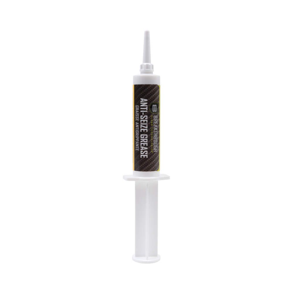 Syringe of anti-seize grease, labeled with "Breakthrough," designed to prevent corrosion and seizing on metal surfaces.