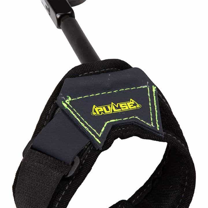 Close-up of a black archery strap with a yellow "PULSE" logo and green stitching.