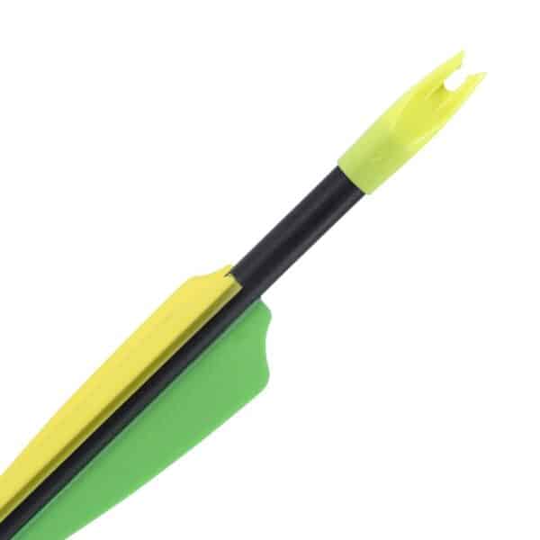 Close-up of an archery arrow featuring a black shaft, bright yellow nock, and green fletching, highlighting its aerodynamic design.