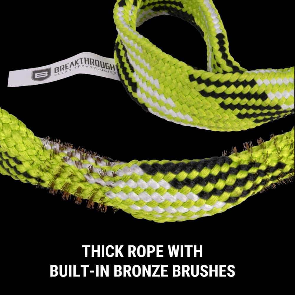 Close-up of a thick, braided rope in neon yellow and black, featuring integrated bronze brushes for cleaning.