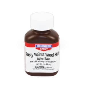 BIRCHWOOD CASEY RUSTY WALNUT WOOD STAIN - 3OZ - Bottle of Birchwood Casey Rusty Walnut Water-Based Wood Stain, 3 fl oz, labeled with color description and caution for use.
