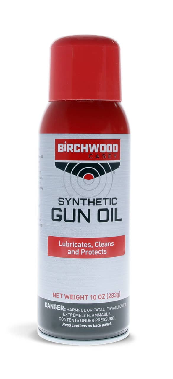 BIRCHWOOD CASEY SYNTHETIC GUN OIL AEROSOL - 10OZ - A can of Birchwood Casey Synthetic Gun Oil, labeled with instructions to lubricate, clean, and protect firearms, with hazard warnings.