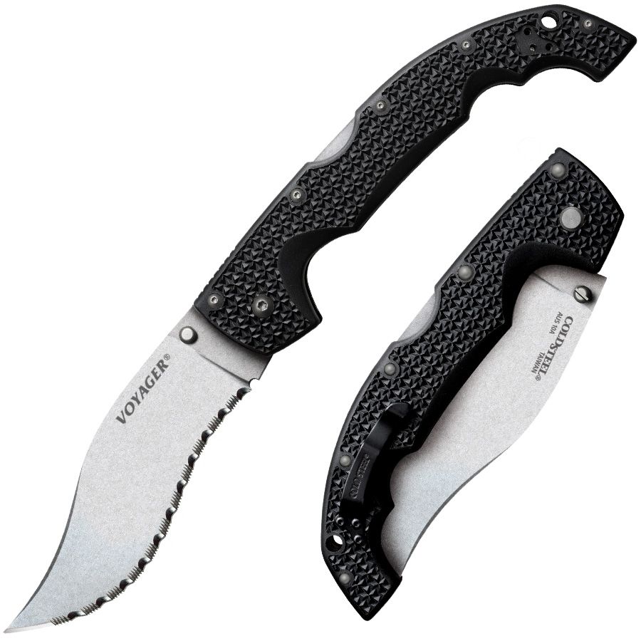 COLD STEEL VOYAGER XL VAQUERO - SERRATED EDGE - Two Cold Steel Voyager folding knives, one open with a serrated blade, the other partially closed. Both knives feature black textured handles with a starburst pattern. The open knife is labeled "Voyager" on the blade, while the closed knife displays "Cold Steel" and "AUS 10A TAIWAN".