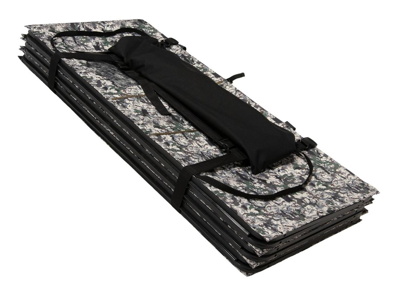Folded camouflage ground blind, secured with black straps, includes a black carrying case.