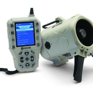 JOHNNY STEWART EXECUTIONER ELECTRONIC GAME CALLER - A tan and black electronic predator call system with a handheld remote control and a speaker unit, both branded with "Hunters Specialties." The remote displays a menu with several animal calls to choose from. The speaker unit has a handle and stands.