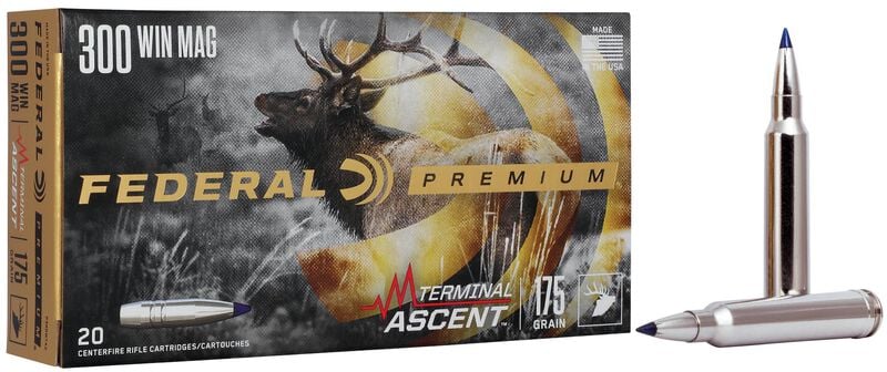 FEDERAL TERMINAL ASCENT 300 WIN MAG 175 GRAIN - Box of Federal Premium Terminal Ascent 300 Win Mag rifle cartridges with two silver bullets displayed beside it.
